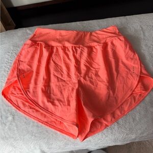 Bright orange running shorts